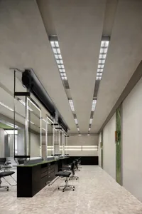 Modern salon interior designed with concrete and mirrors.