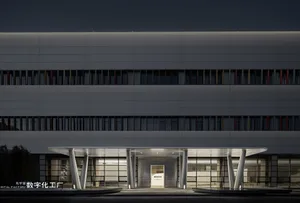 A modern office building featuring metallic and glass materials.