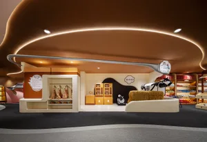 A modern retail interior with a brown color scheme designed for children's shop