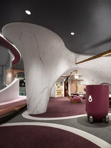 A modern retail space featuring marble surfaces and contemporary design elements.