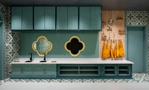 Modern commercial space featuring marble countertops, tile patterning, and concrete walls.