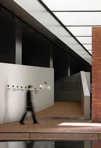 A minimalist interior design with concrete walls and flooring, featuring a sleek, contemporary aesthetic.