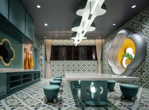 A modern restaurant interior with a tile floor, green and white color scheme, and unique lighting fixtures.