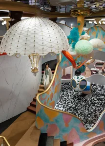 An image of a playful, colorful children's playroom with a ball pit, abstract art, and whimsical decor.