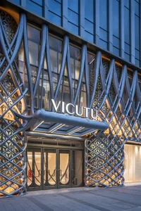 Modern retail storefront with metallic paneled cladding