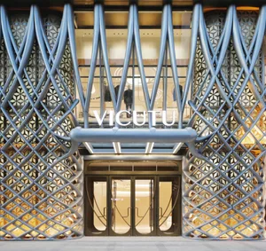 Modern retail storefront with metal geometric patterns on the facade