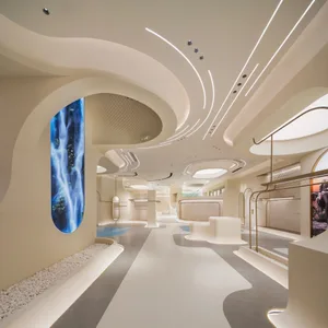 A futuristic lobby with modern concrete walls and lighting features.
