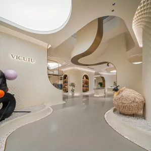 Modern retail store interior featuring sleek concrete and white marble surfaces.
