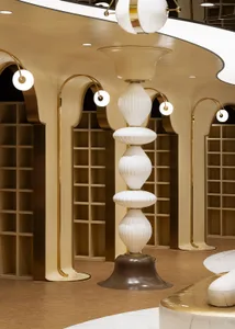 A modern retail storefront featuring glass, metal, and wood elements.