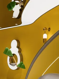 Modern retail space interior featuring yellow tinted glass and minimalist design elements.