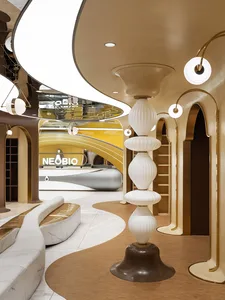 A modern retail space featuring a white marble seating area and black metal architectural elements.