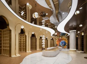 A modern retail space featuring glass, marble, and concrete materials.