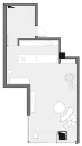 Minimalist apartment layout with concrete flooring and a compact design.