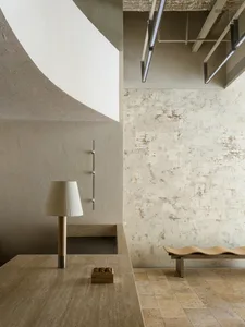 Modern interior space featuring concrete materials and minimalist design elements.