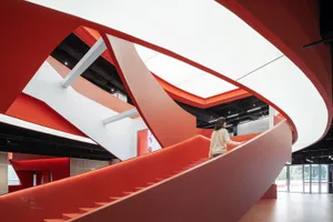 A modern interior design featuring red stone elements