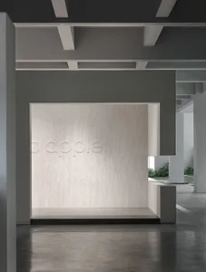 Modern minimalist commercial interior with textured concrete wall
