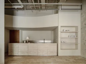 Modern concrete coffee bar with minimalist design elements.