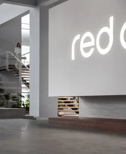 A modern lobby space with concrete flooring and minimalist design.