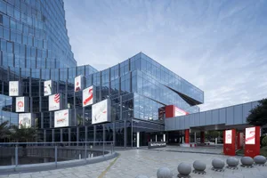 Modern minimalist design museum with glass exterior.