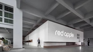 A modern office space featuring industrial design elements with concrete and white finishes.