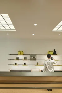 Minimalist storefront with glass and metal elements.