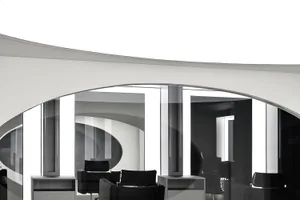 Modern office space with glass and concrete walls and floors.