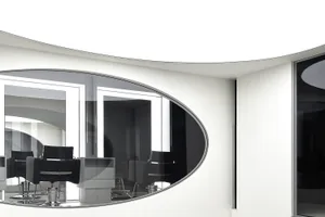 Modern, minimalist salon interior with sleek black chairs and white walls.