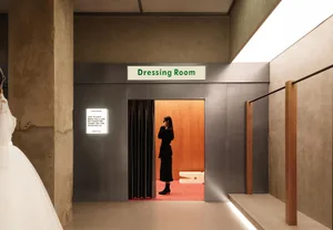 A minimalist interior design featuring metal elements in a dressing room setting.