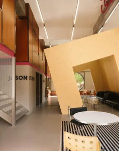 A sophisticated, modern coffee shop with tile accents and minimalist design.