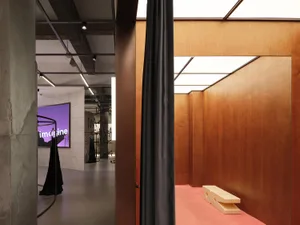 A modern retail shop with wooden walls and a minimalist design.