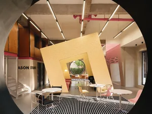 Industrial-style coffee shop interior with wooden elements