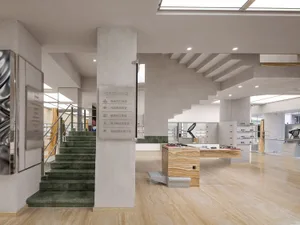 A modern showroom featuring marble and concrete furniture displays.