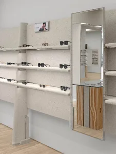 A modern retail display featuring granite shelves with glasses displayed