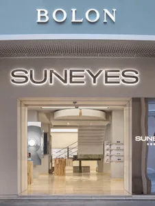 Modern retail storefront with concrete materials and a minimalist design.