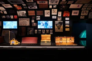 Retail storefront exhibit featuring branded merchandise and vintage items.