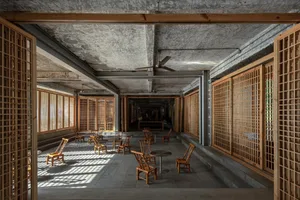 Industrial-style lobby with concrete flooring and modern furniture