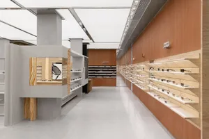 A modern glasses shop with a wooden interior.