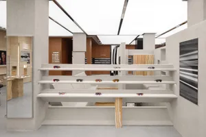 A modern retail interior with concrete and marble materials.