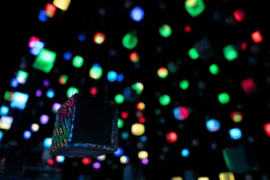 Modern, multi-colored LED lights suspended in a dark space