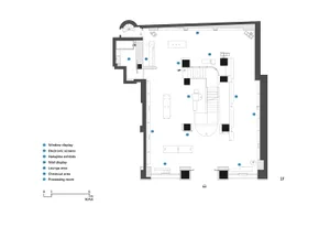 A 2D architectural drawing of a modern retail shop featuring a white concrete interior layout.