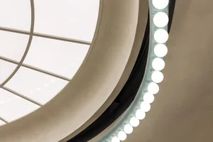 Modern interior design featuring geometric metal ceiling lights.