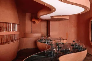 Modern exhibit display featuring glass, metal, and plastic elements.