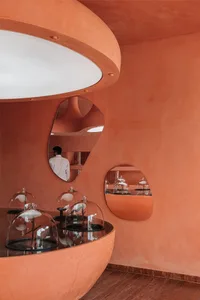 Modern retail store with glass and curved architectural elements.