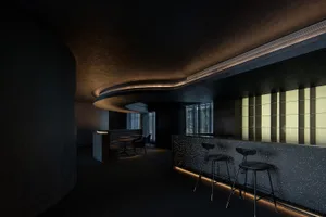 Modern bar with concrete walls, glass windows, and metallic accents