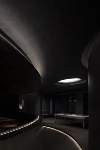 A modern interior space with concrete walls and minimalist design.