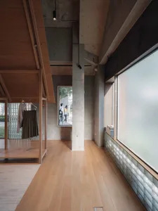 A retail space featuring modern design elements, including wood and concrete.