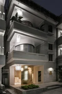 The interior of a modern apartment featuring concrete walls and modern design elements.