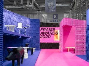 An exhibition space with minimalist design featuring plastic bricks.