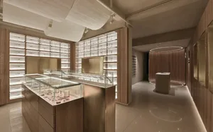 A modern retail storefront featuring glass windows and minimalist design.