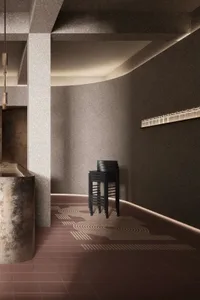 A modern restaurant entryway featuring a concrete design.